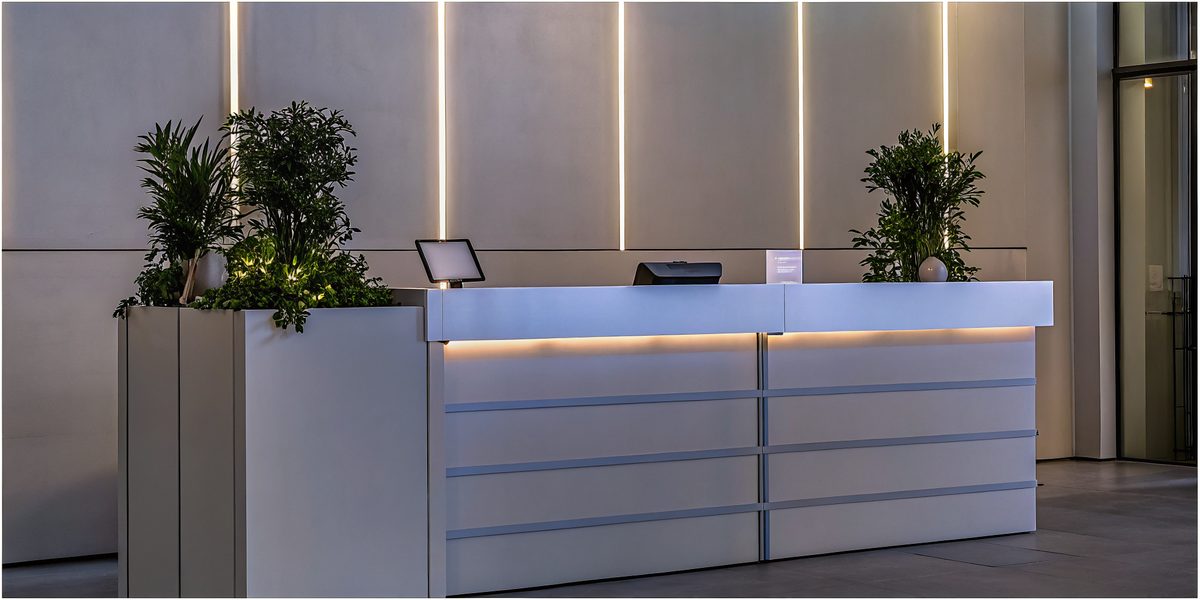 Visitor welcomed at a corporate reception desk